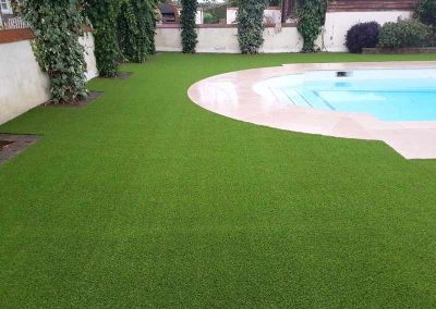 Artificial grass laid around a swimming pool